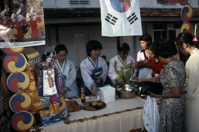 Korean students manning a booth at a food fair