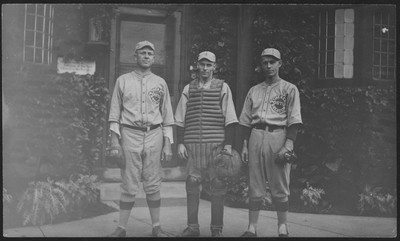 Three unidentified members of the Postum Baseball team