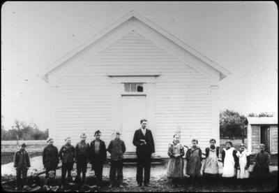Otto Graf posing with students in front of his first school